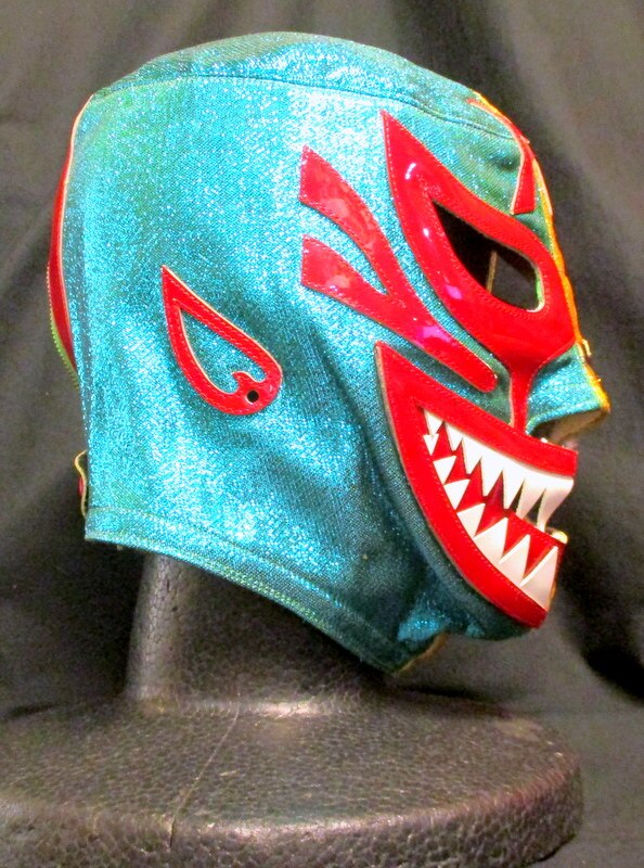 プロレスマスク 【ミル・マスカラス(金・緑ラメ×黒・赤フチ)】 タグ