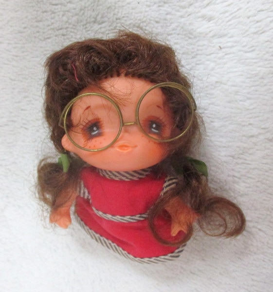 soft doll with glasses