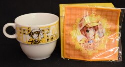 a stack -- a mug -- + cloth coaster 