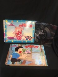 A home {picture-card show with a phono sheet 